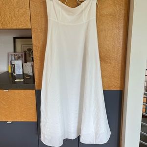 Summer dress with spaghetti straps. Straps crisscross in the back. Side zipper.